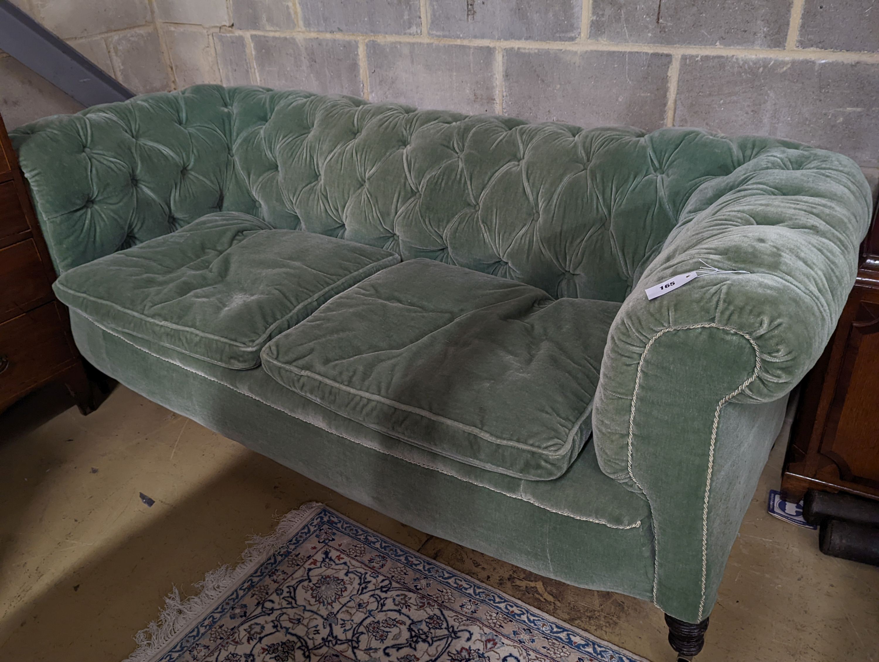A late Victorian Chesterfield settee upholstered in buttoned green fabric, length 194cm, depth 80cm, height 76cm